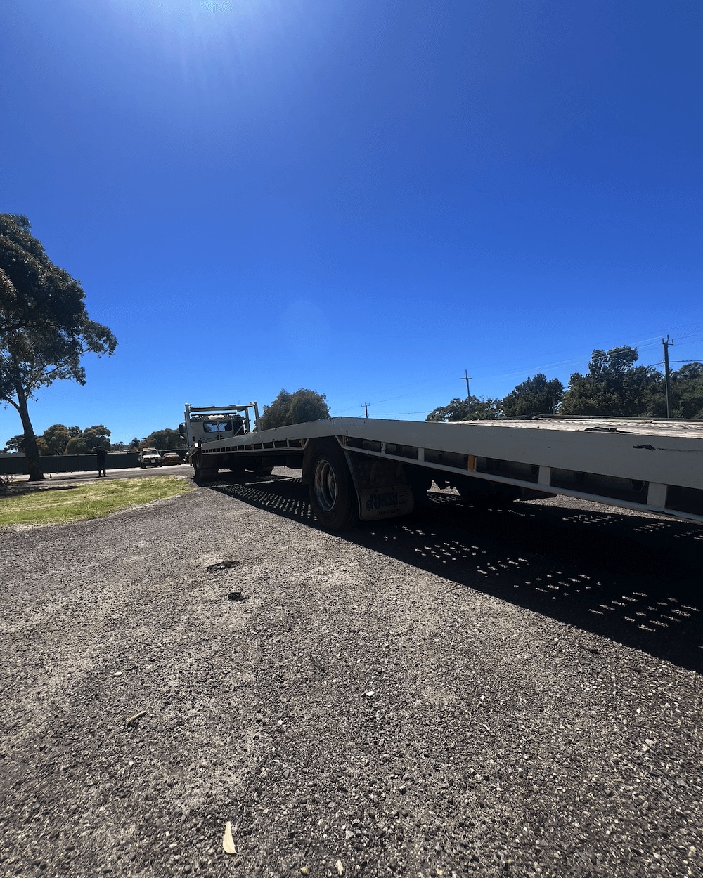 Large tilt tray truck extended and ready for vehicle loading